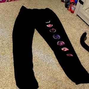 black Sweatpants with the moon cycle on right leg.